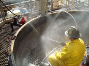 crew member performing industrial cleaning